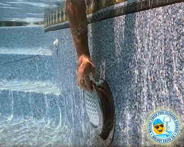 Replacing a swimming pool ligh bulb in Walnut Creek, CA